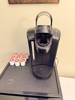 Front view of Keurig brewer with 8 K-Cup pods