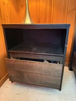 Front view showing open shelf and misaligned drawer