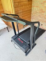 Full view of Pro-Form 585ex treadmill folded down