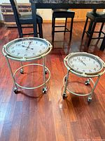 Both nesting clock tables showing size difference and casters