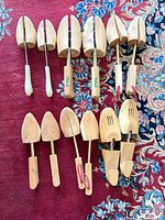 All cedar shoe trees laid out showing quantity, sizes and types