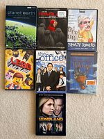 Front covers of all seven DVD cases displayed
