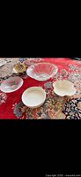 Overview of five bowls on rug