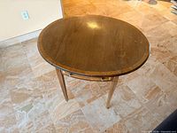 Table with leaves raised showing oval top, overall view