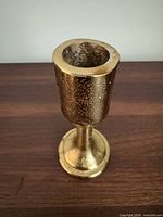 front view of brass taper candle holder