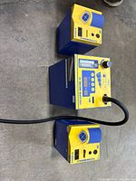 Front view of Hakko 850B rework station flanked by two Future Module units