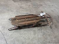 Full side view of wooden Speedway sled folded