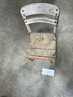 Top view of Envoy wood seat and metal frame chair showing wear