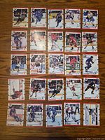All 25 Score hockey cards laid out 5×5 on table
