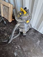 Full view of Stanley shop vac with hose and cord
