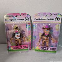 Both sealed Funko Five Nights at Freddy's Chocolate action figures in packaging