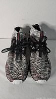 Top view of both Adidas Tubular Nova sneakers showing knit uppers and laces