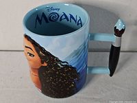 Front view showing Moana graphic and sculpted oar handle