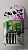 Front of sealed Energizer Recharge charger package showing four AA batteries