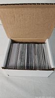 Box filled with sleeved football trading cards
