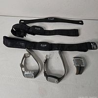 All items: three chest straps with transmitter modules and three wrist watches