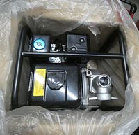 water pump in box with plastic wrap