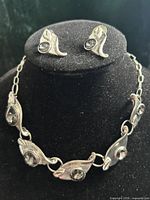 necklace displayed with matching stud earrings