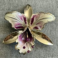 Front view showing full orchid shape, enamel colours and rhinestones