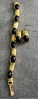 Bracelet and both earrings displayed together