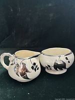 Creamer and sugar bowl side by side showing overall style and matching design