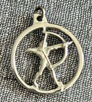Front view of silver-tone circular pendant showing archer design