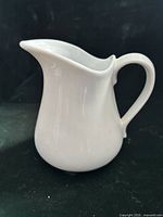 side profile showing spout, handle, and body