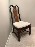 Single chair angled view showing frame, burl veneer splat and upholstered seat