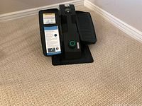 Front view of Cubii JR elliptical showing pedals and resistance knob