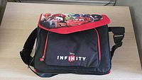 Front view of black and red Disney Infinity carrying bag