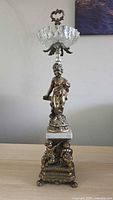 full view of brass epergne on table
