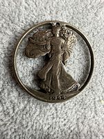 Obverse side of cut-out 1944 Walking Liberty half dollar pendant