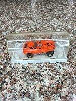 Slot car in display case, side view