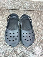Top view of black Crocs clogs showing ventilation holes and footbeds