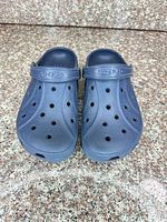 Top view of navy Crocs clogs showing perforations and heel straps