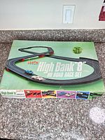 Box top displaying Eldon High Bank '8' HO Road Race Set graphics