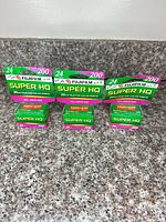 Front view showing three Fujifilm Super HQ film boxes