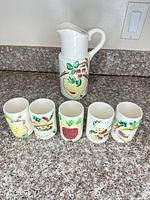 Pitcher and five tumblers front view