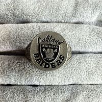 Top view showing Raiders logo and lettering on ring face