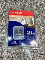 Front of sealed blister pack showing card and 256 MB capacity
