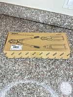 Retail box for SHALL 3-piece pliers set displayed on countertop