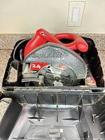 Front view showing Skil circular saw with 2.4 HP 13 AMP label and ACE 7-1/4 in blade in plastic carrying case