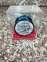 Front view of teal yo-yo in clear case showing TigerShark logo
