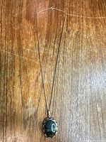 Full view of necklace with pendant and chain