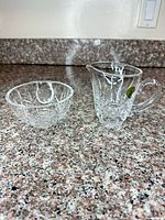 Creamer and sugar bowl side by side showing size and pattern
