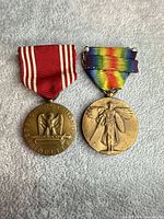 Front view of both medals with ribbons