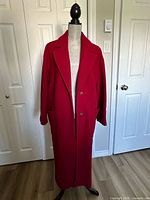 Front view of red Banana Republic coat on mannequin showing full length and button placement