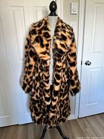 Front view of leopard faux fur coat on mannequin