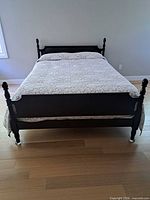 Full view of assembled low poster bed with beadspread