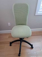 Front view of sage green IKEA task chair showing overall design